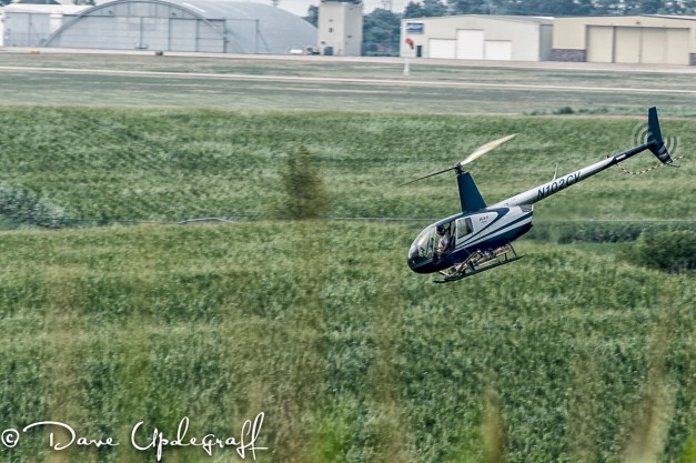 Helicopter Dusting A Corn Field