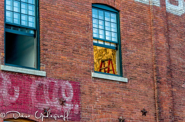 A Red Step Ladder in the window