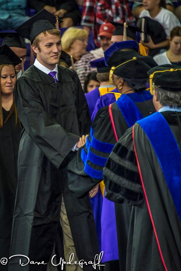 Mark receives his diploma